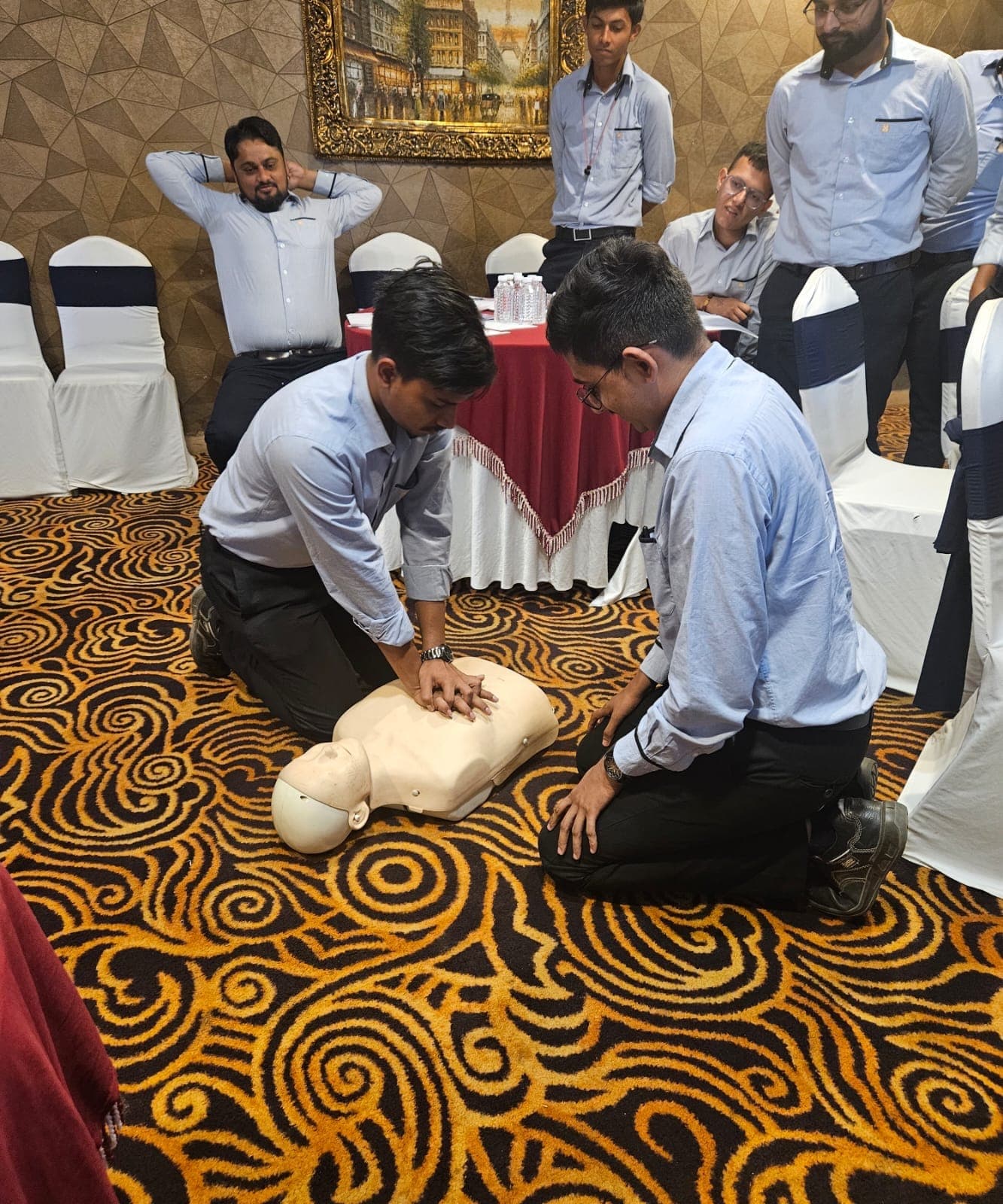 Trainees practising chest compressions on CPR manikins during Eduforce first aid training