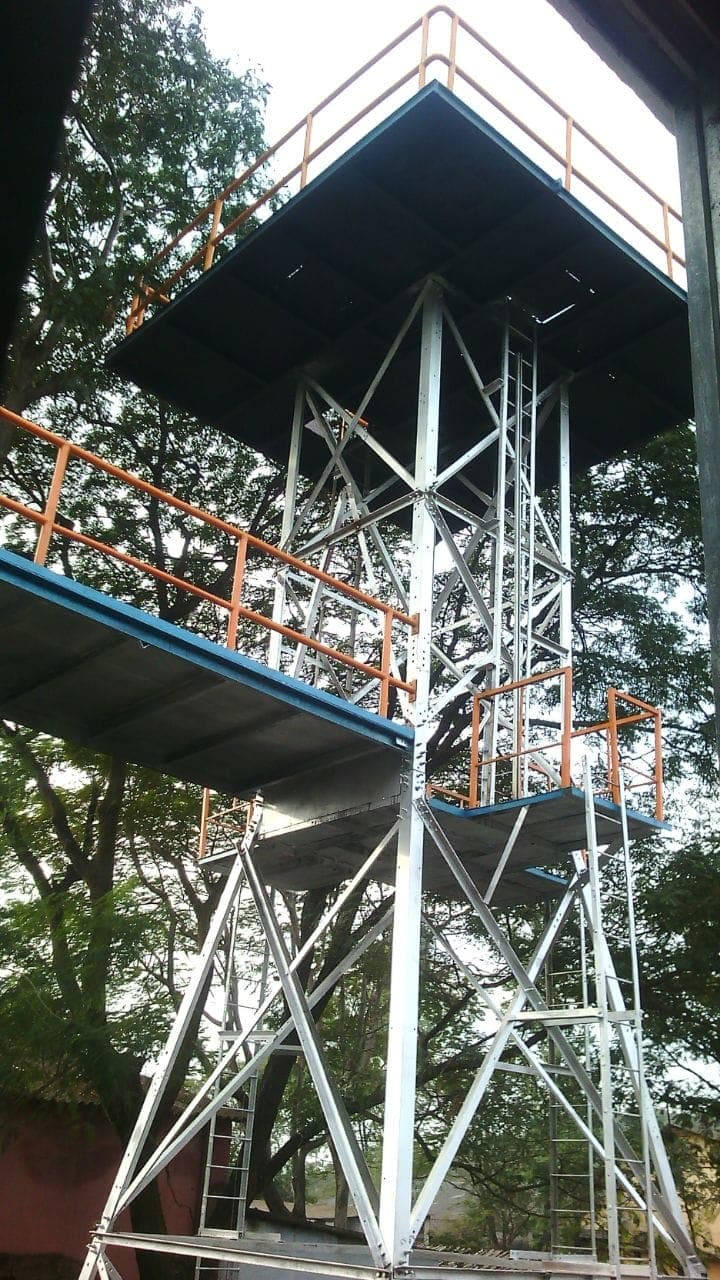 Full view of the training tower structure and access stairs