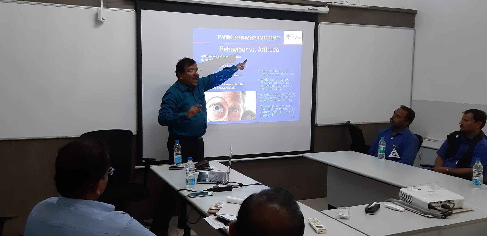 Trainer presenting a slide on behaviour and attitude during a behaviour based safety session