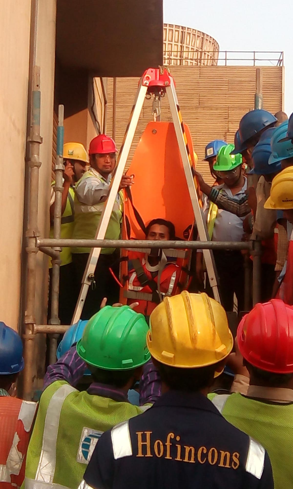 Rescue tripod and winch rigged over a confined space entry point during a practical demonstration