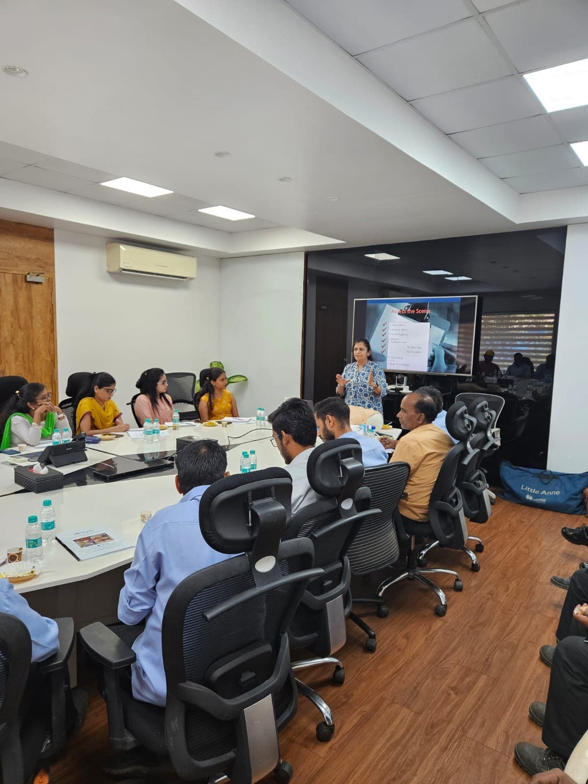 Participants seated at tables during a classroom safety programme