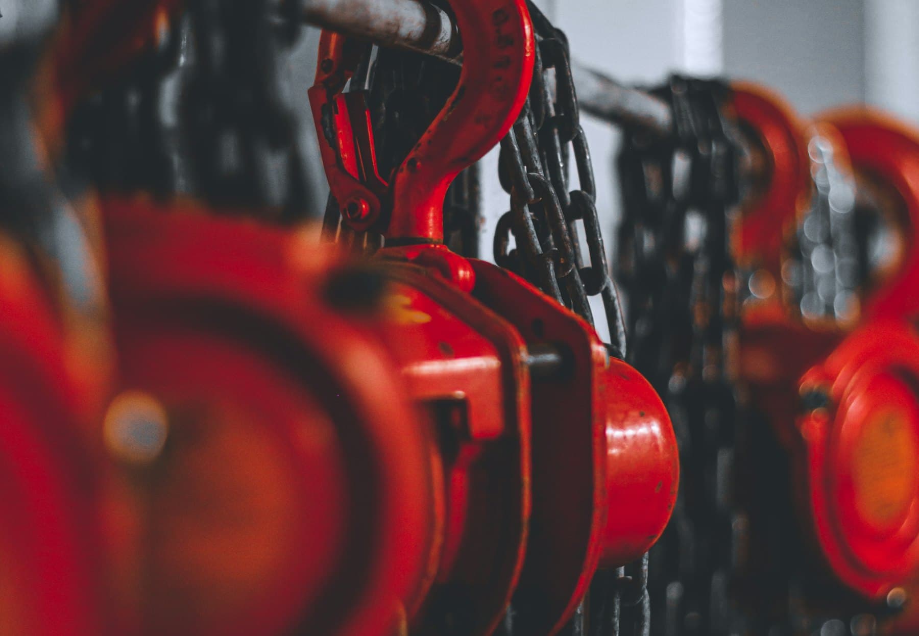 Hoist mechanism being inspected at an industrial facility