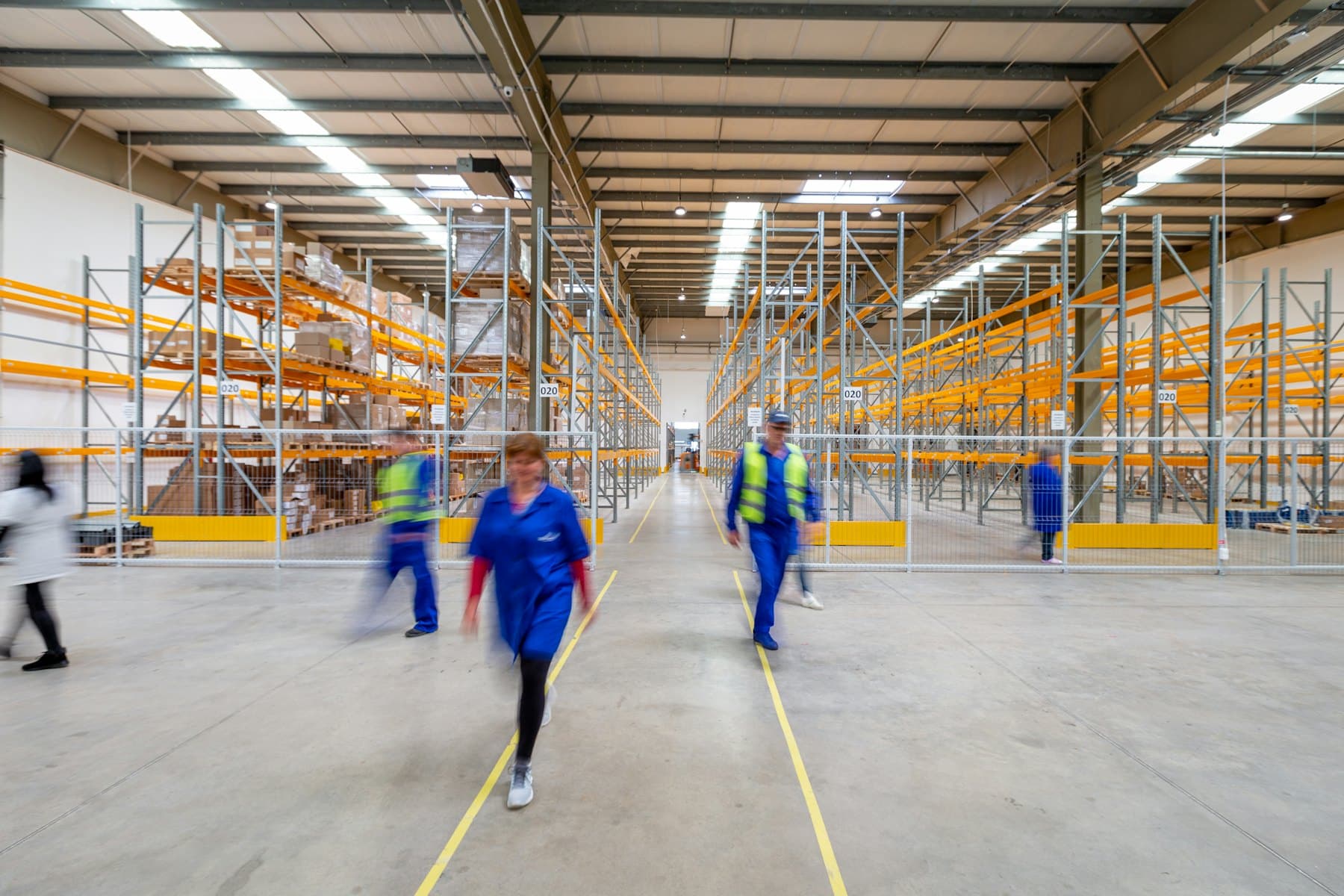 Warehouse operations with forklift and racked storage