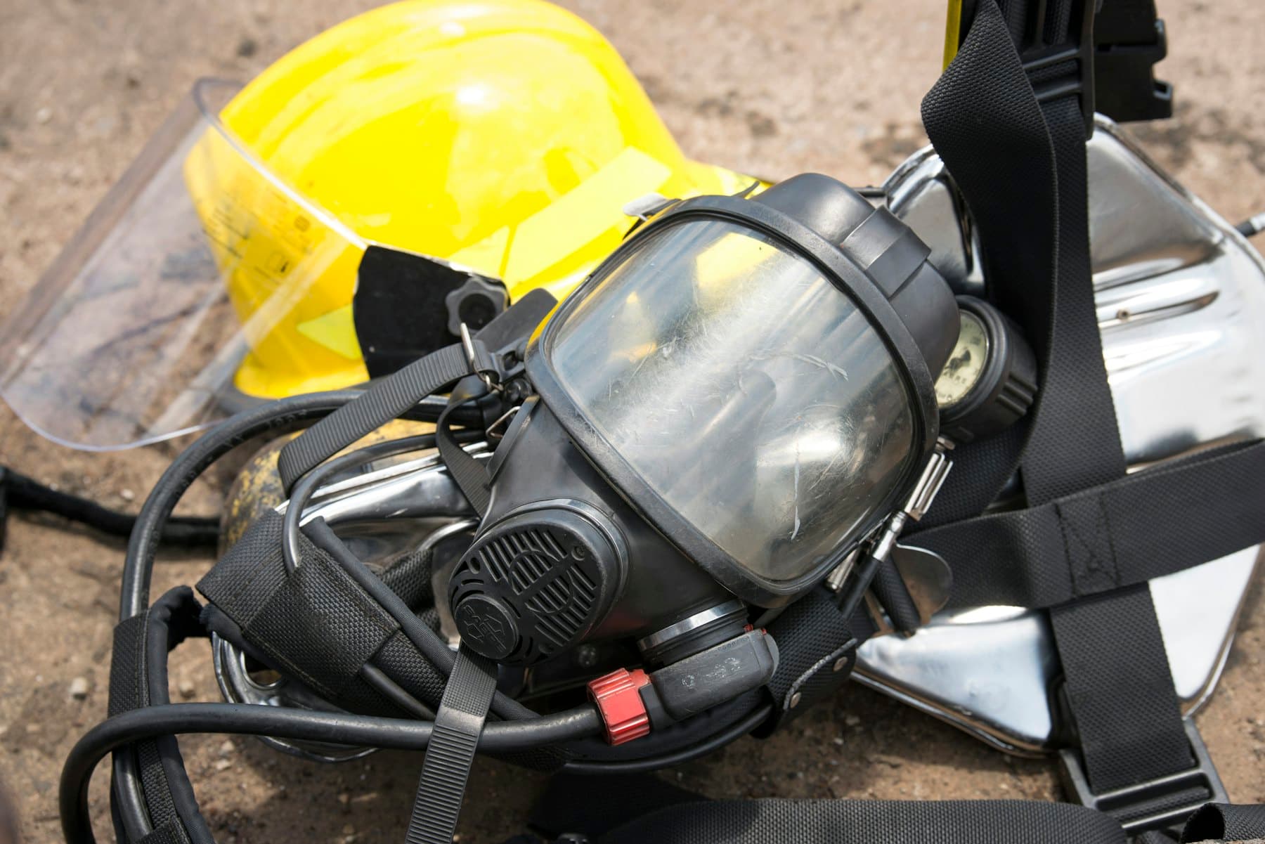 Worker performing a seal check on a respirator