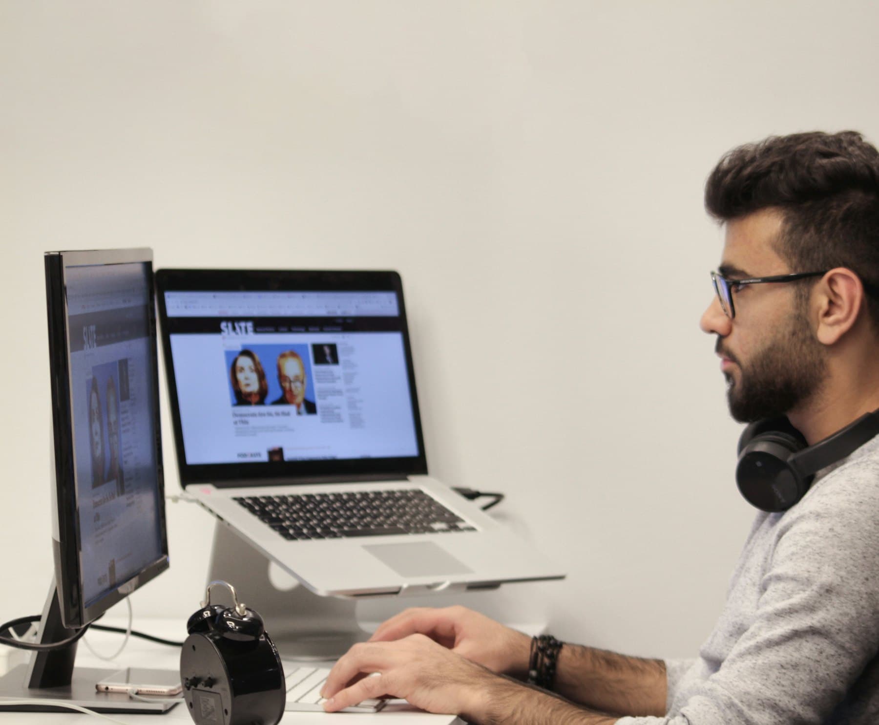 Person working at a desk workstation in an office environment