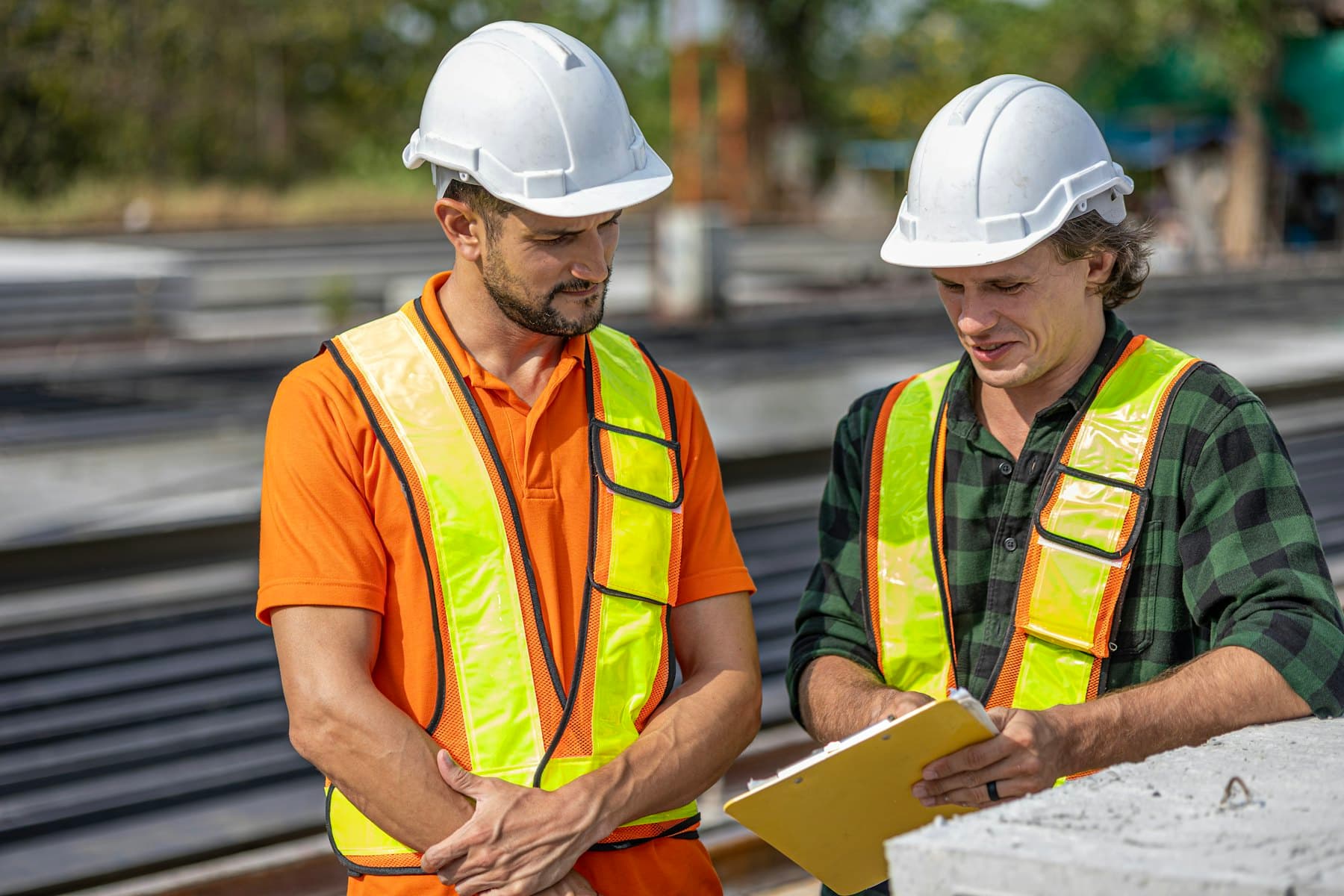 EHS consultant reviewing safety systems on an industrial site